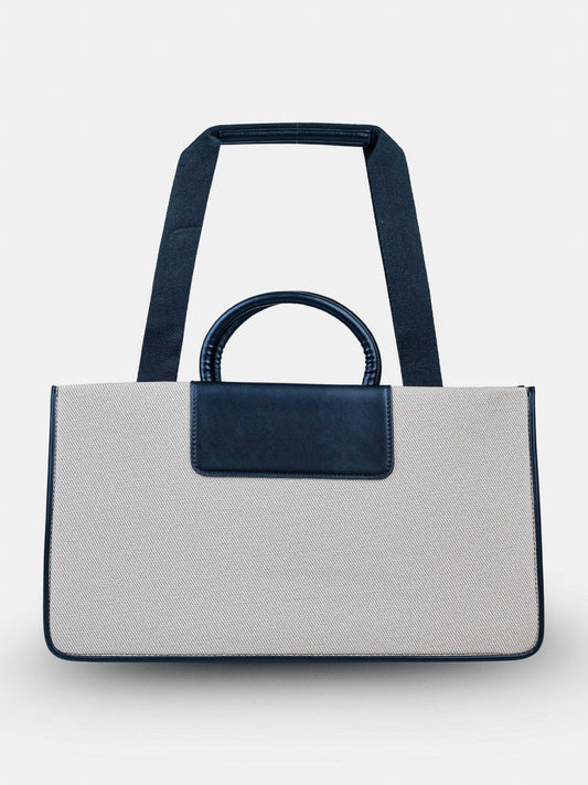 Florence Ivory Noir vegan leather tote bag in off white and black tones with structured design and dual handles for women.