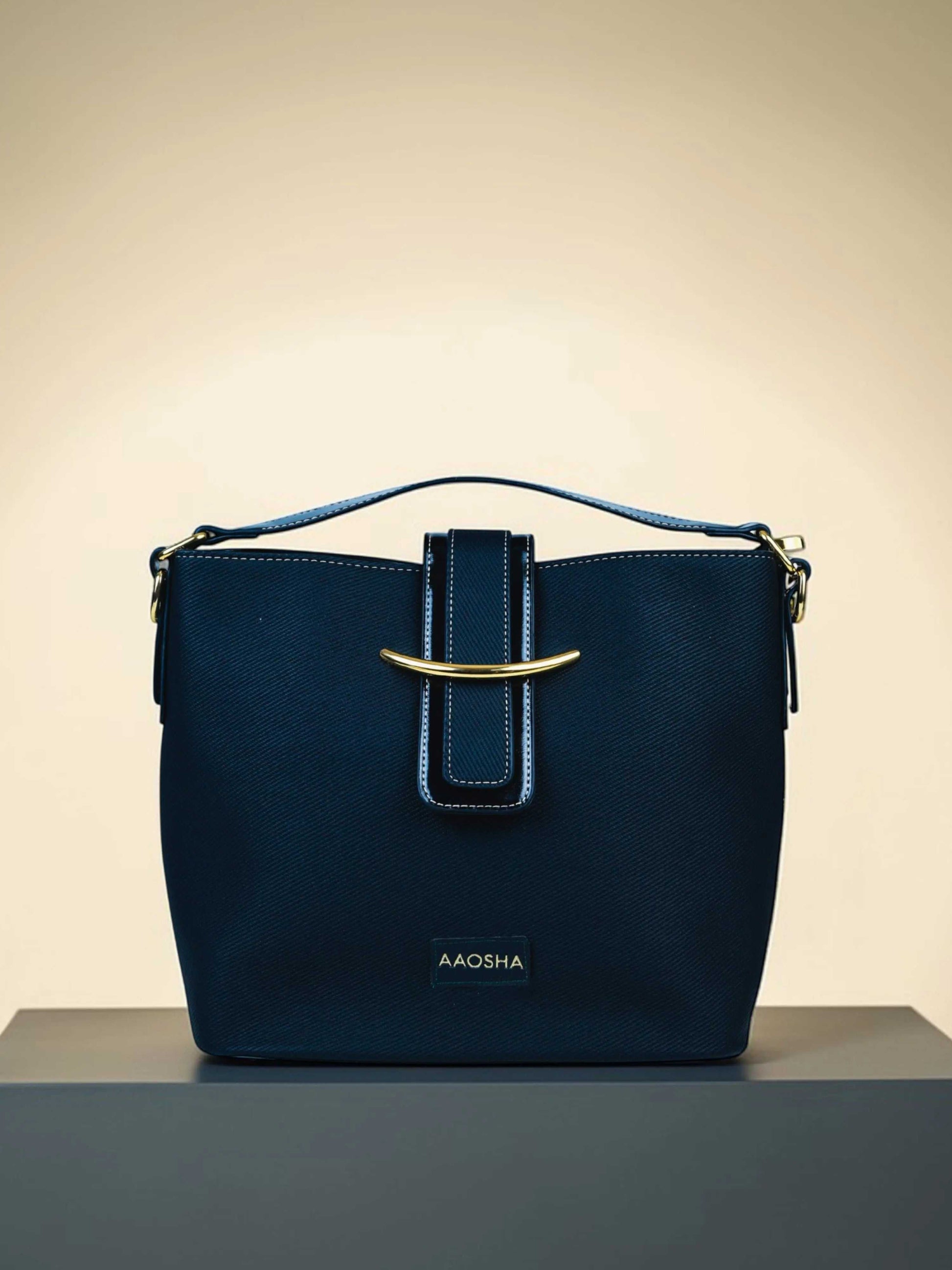 Aurora Eternal Ink vegan leather bucket bag in black with structured bucket silhouette and dual handles for women.