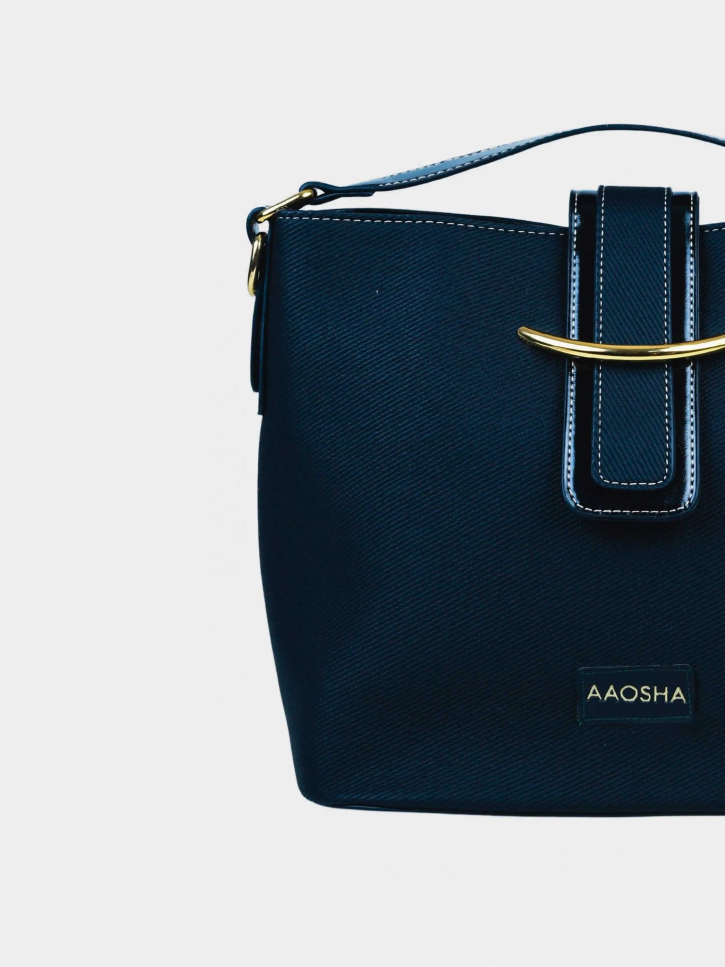 Aurora Eternal Ink vegan leather bucket bag in black with structured bucket silhouette and dual handles for women.