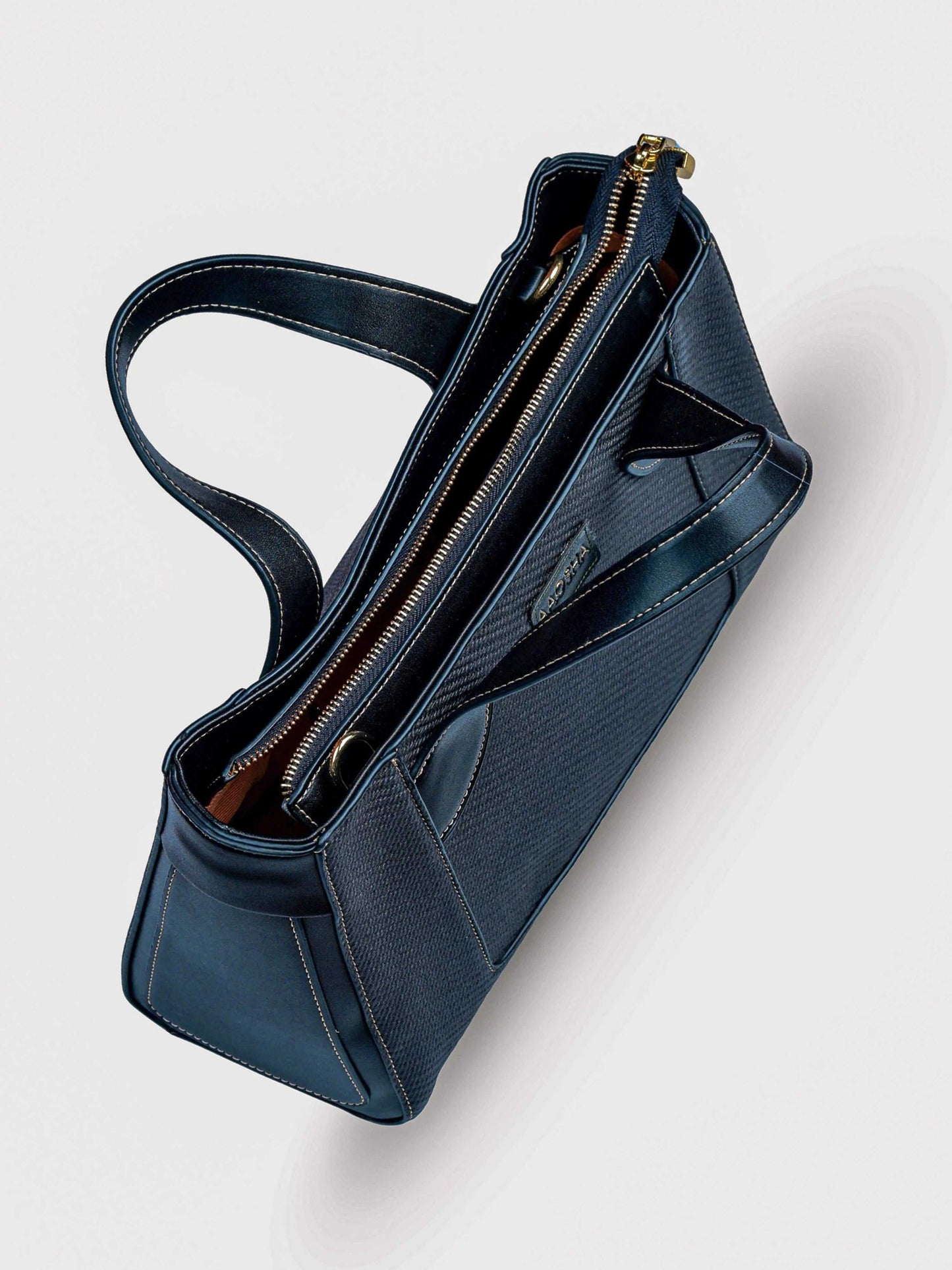 Capri Eternal Ink vegan leather mini tote bag in black with structured design and dual handles for women.
