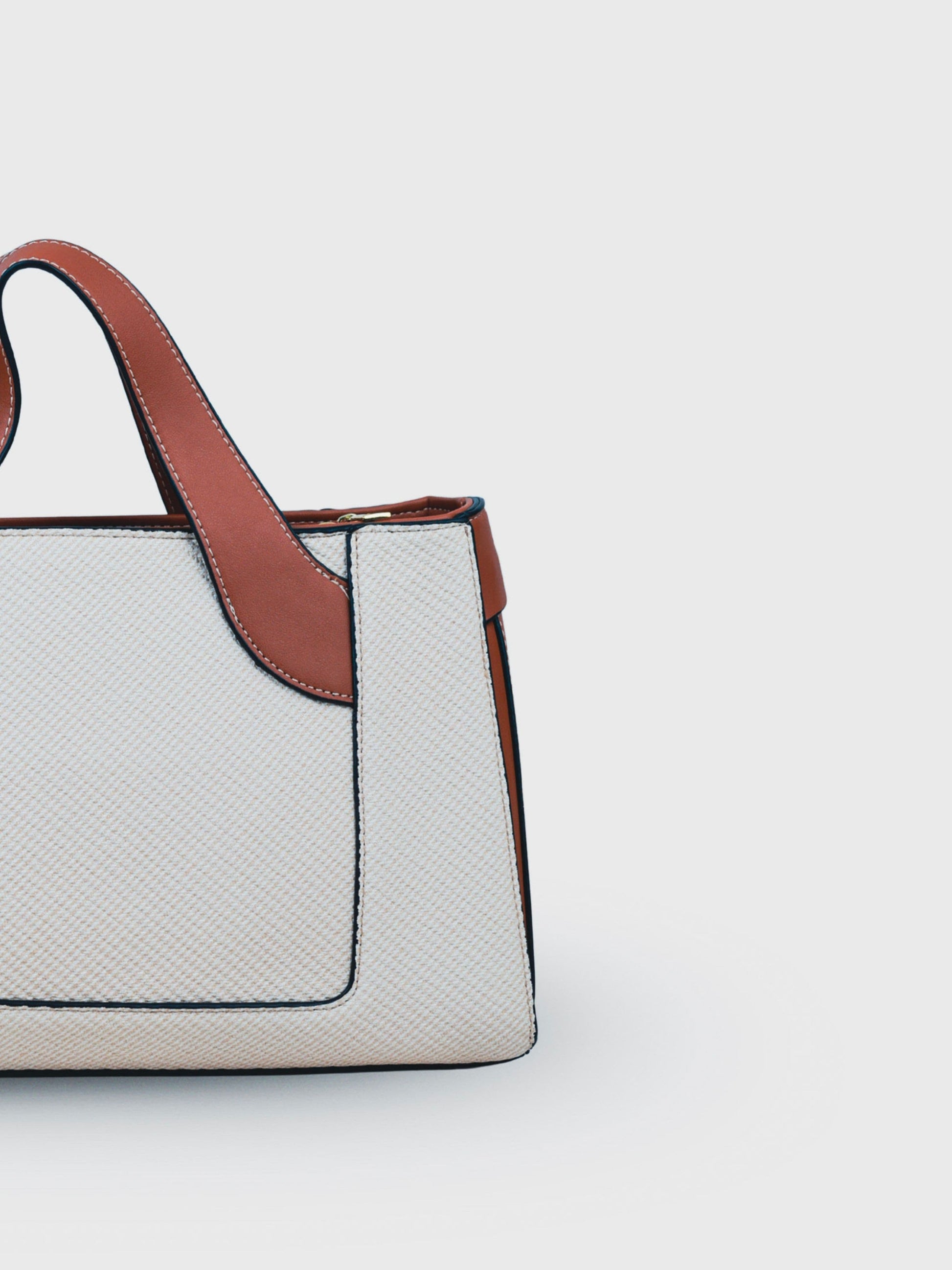 Capri Vanilla Haze vegan leather mini tote bag in soft cream tones with structured design and dual handles for women.