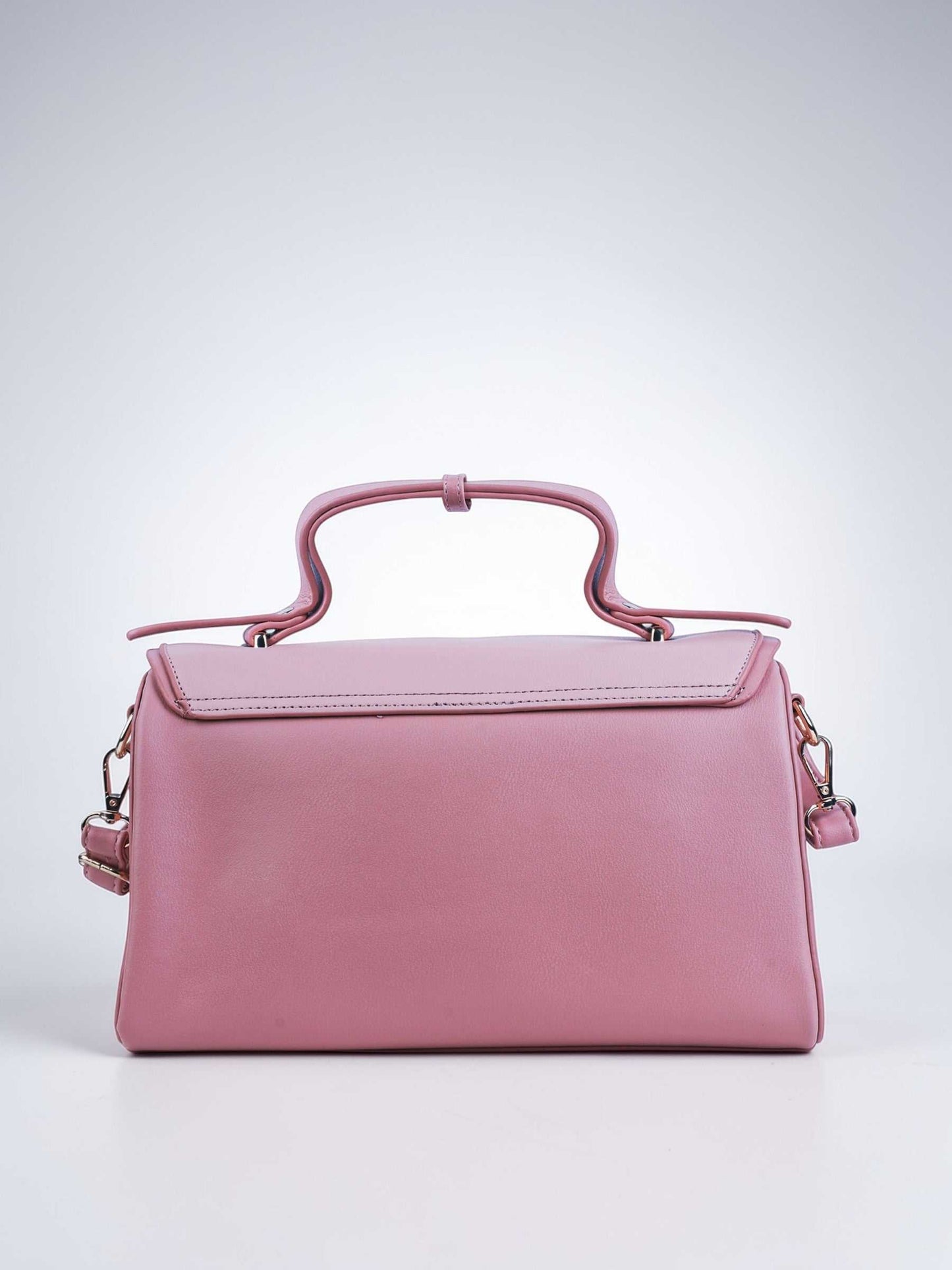 Elara Cotton Candy vegan leather crossbody bag in soft pink with structured design and adjustable strap for women.