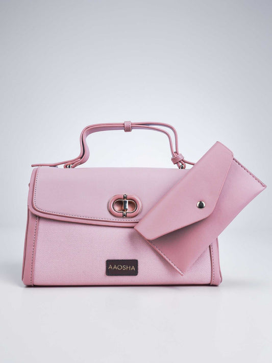 Elara Cotton Candy vegan leather crossbody bag in soft pink with structured design and adjustable strap for women.