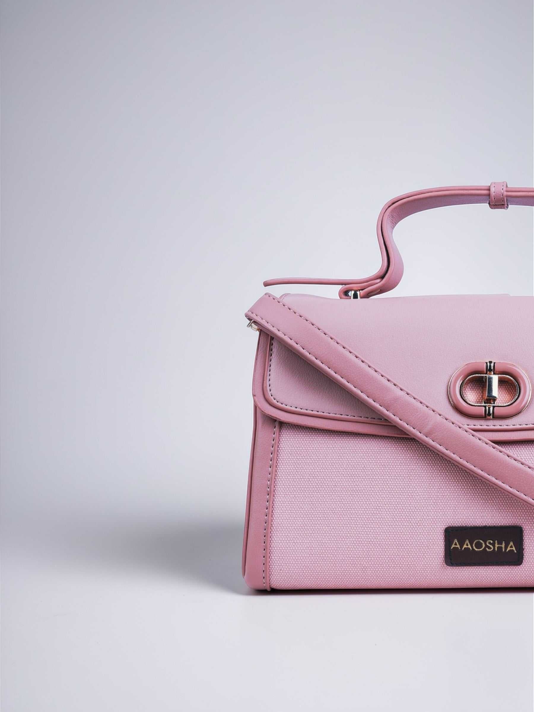 Elara Cotton Candy vegan leather crossbody bag in soft pink with structured design and adjustable strap for women.