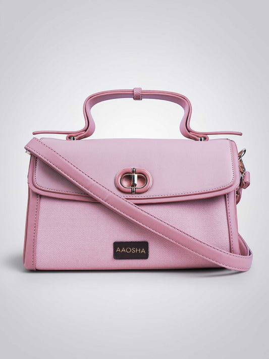 Elara Cotton Candy vegan leather crossbody bag in soft pink with structured design and adjustable strap for women.