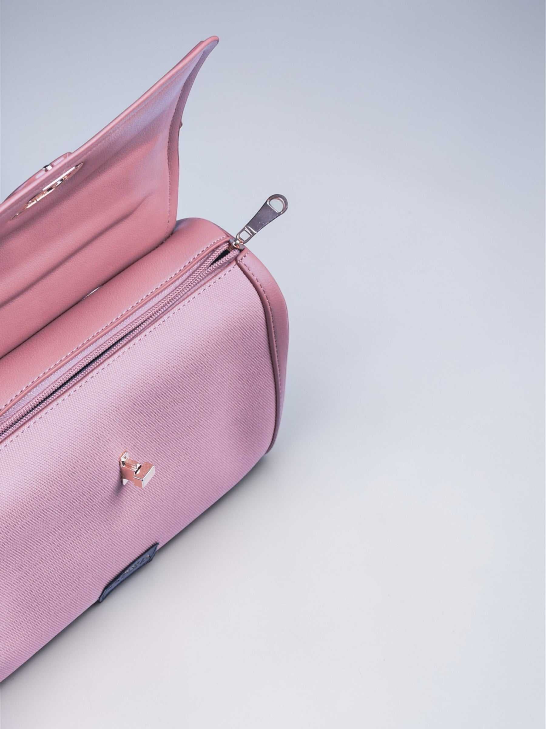 Elara Cotton Candy vegan leather crossbody bag in soft pink with structured design and adjustable strap for women.