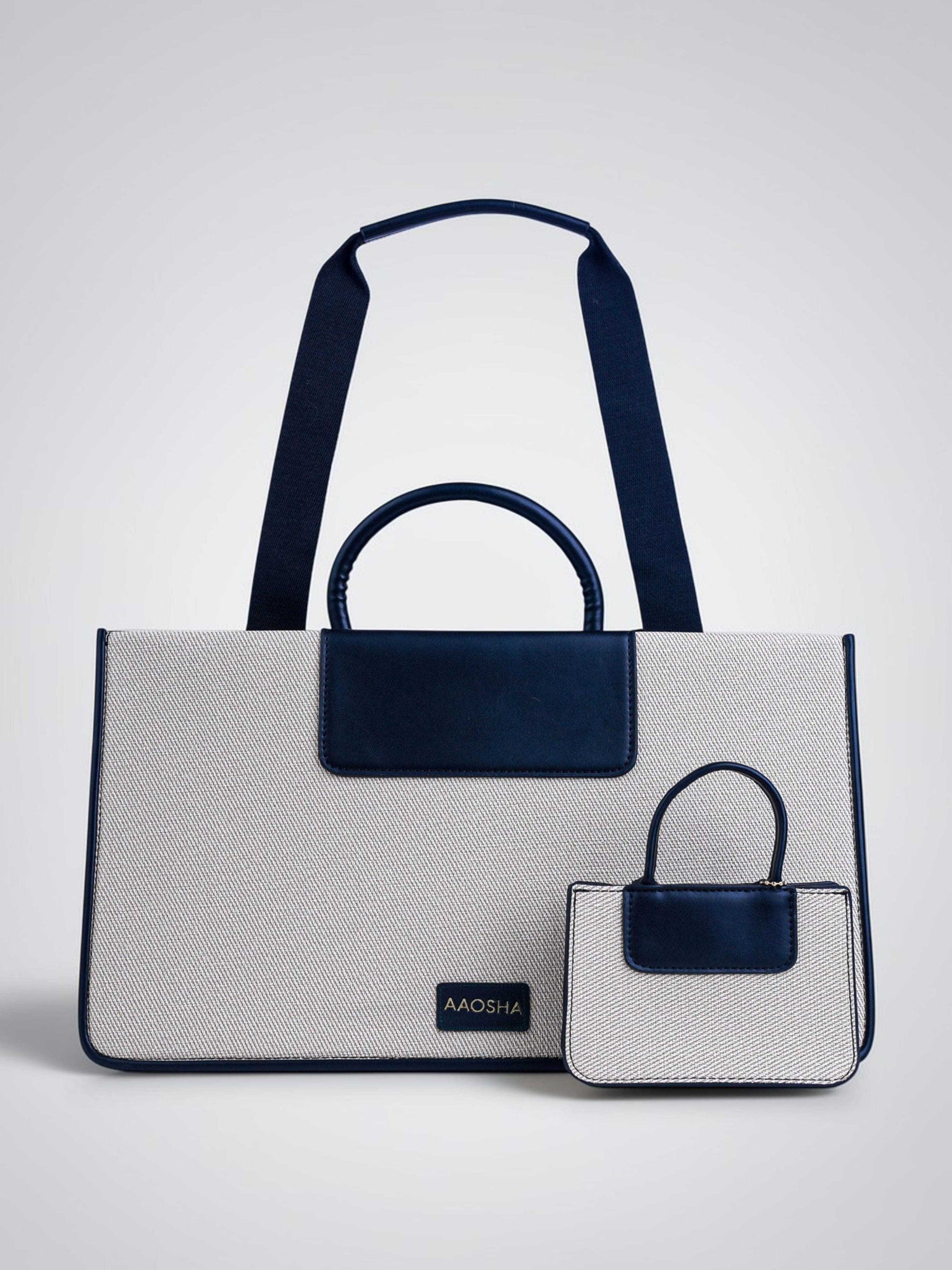 Florence Ivory Noir vegan leather tote bag in off white and black tones with structured design and dual handles for women.