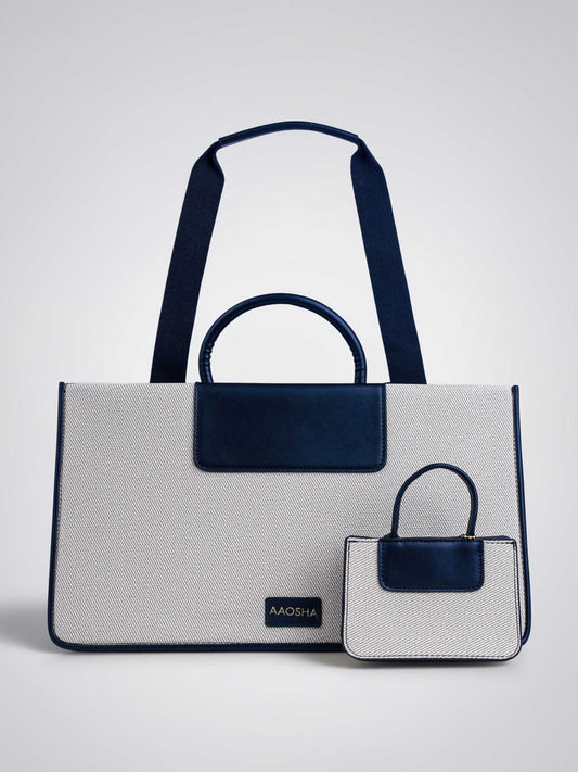 Florence Ivory Noir vegan leather tote bag in off white and black tones with structured design and dual handles for women.