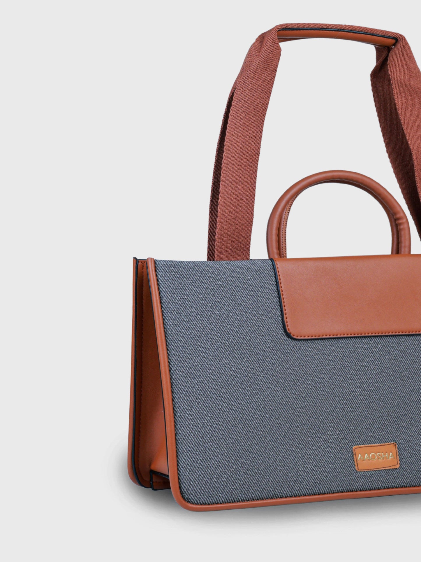 Florence Ash Caramel vegan leather tote bag in warm gray and tan tones with structured design and dual handles for women.