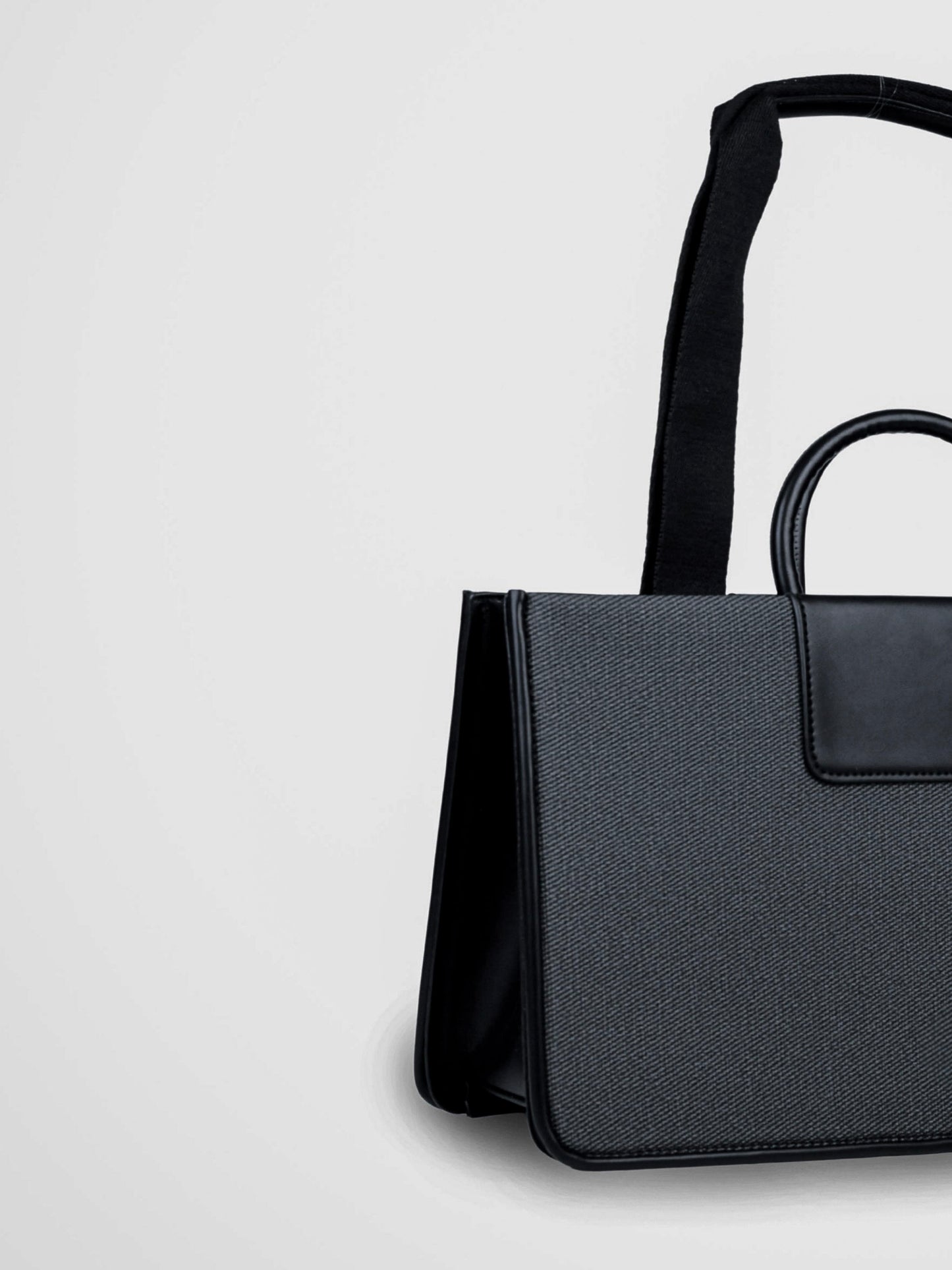 Florence Eternal Ink vegan leather tote bag in black with structured silhouette and dual handles for women.