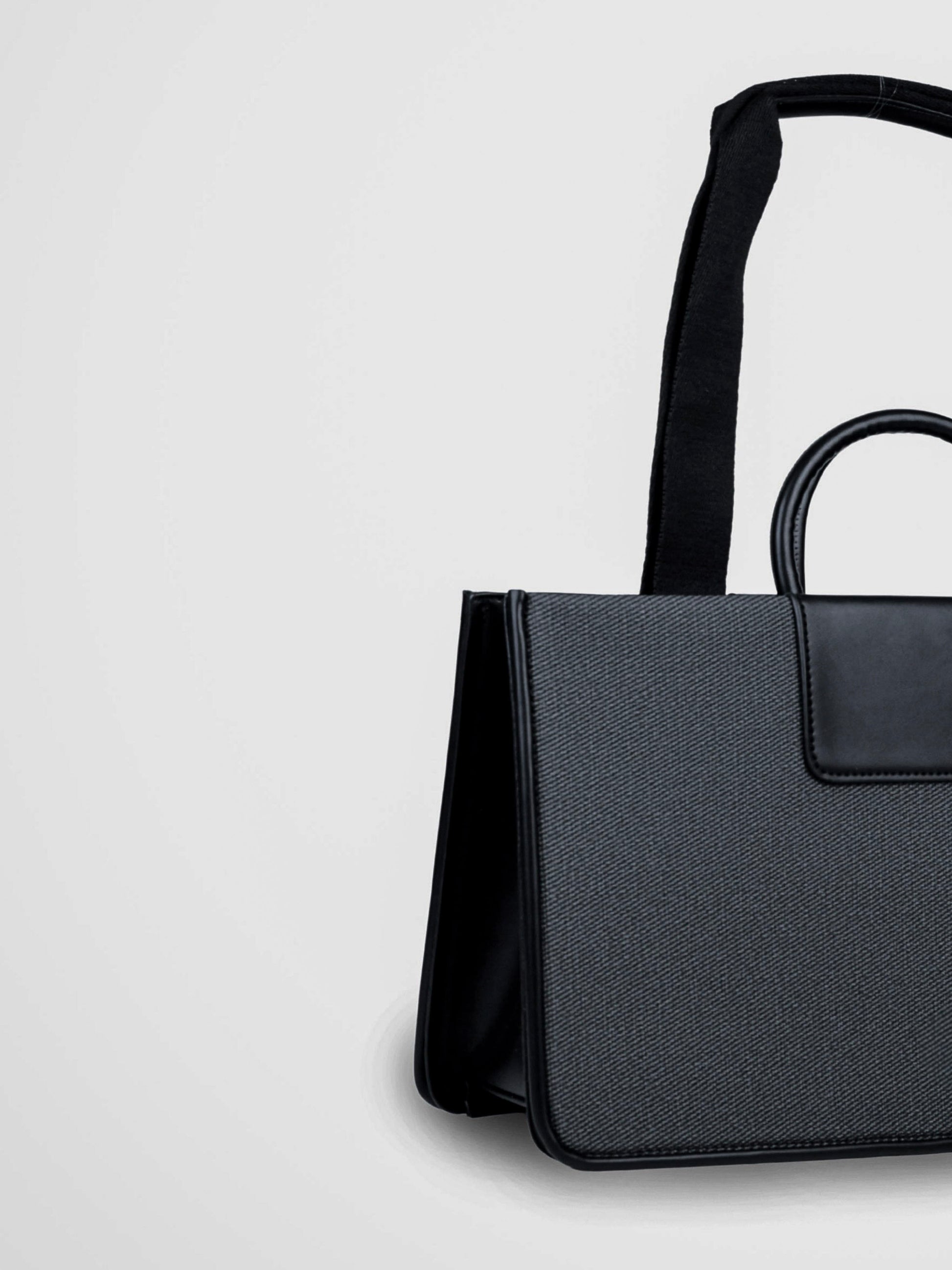 Florence Eternal Ink vegan leather tote bag in black with structured silhouette and dual handles for women.