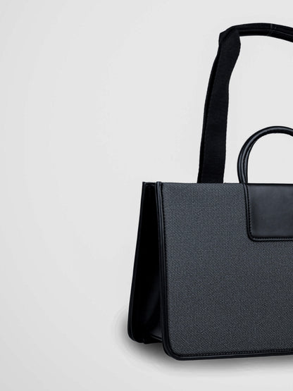 Florence Eternal Ink vegan leather tote bag in black with structured silhouette and dual handles for women.