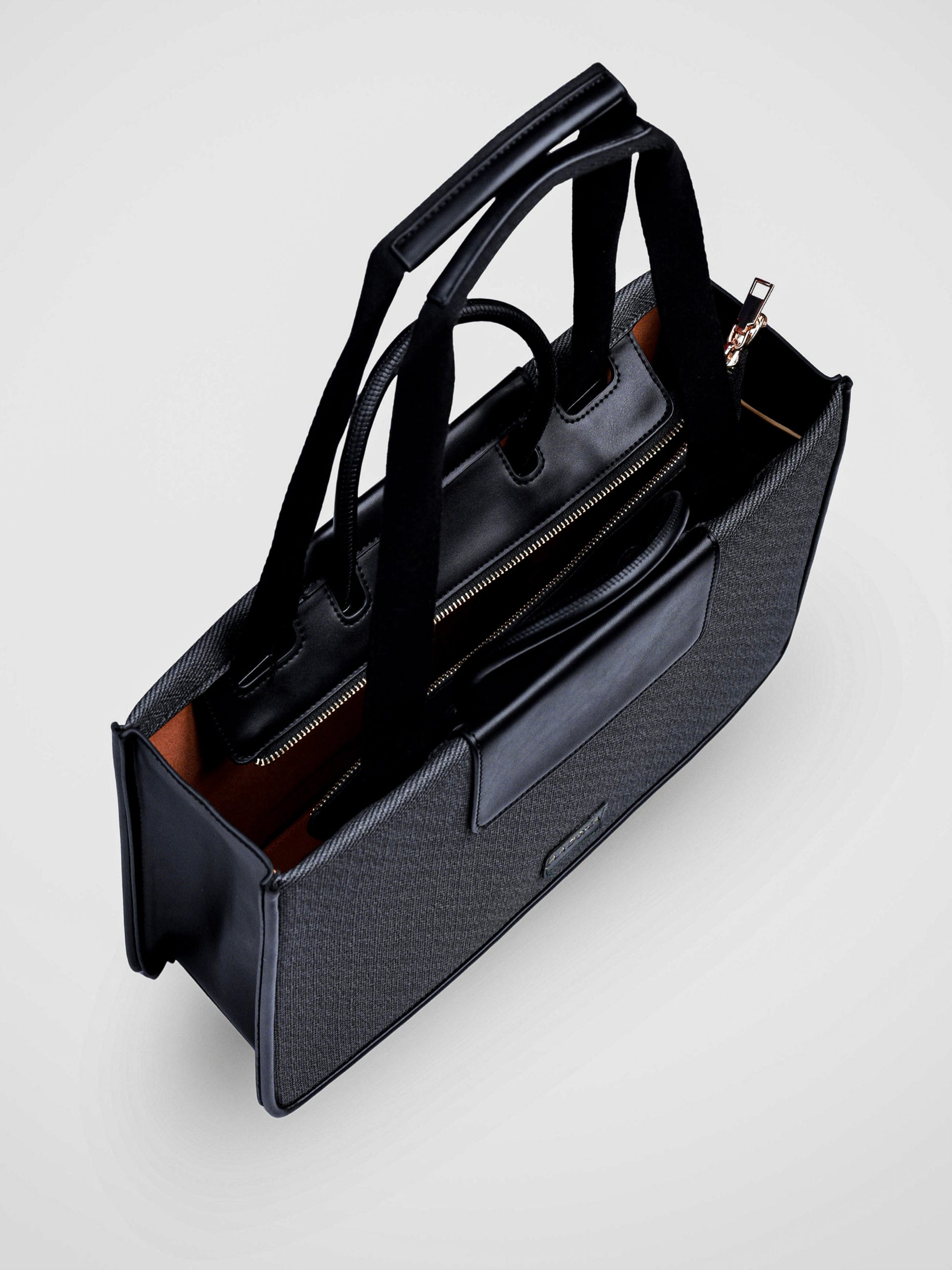 Florence Eternal Ink vegan leather tote bag in black with structured silhouette and dual handles for women.
