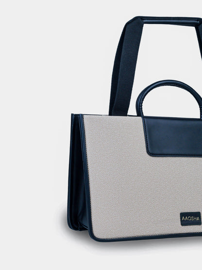Florence Ivory Noir vegan leather tote bag in off white and black tones with structured design and dual handles for women.