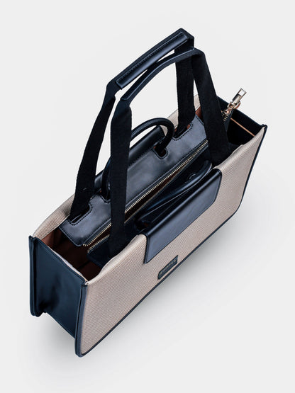 Florence Ivory Noir vegan leather tote bag in off white and black tones with structured design and dual handles for women.