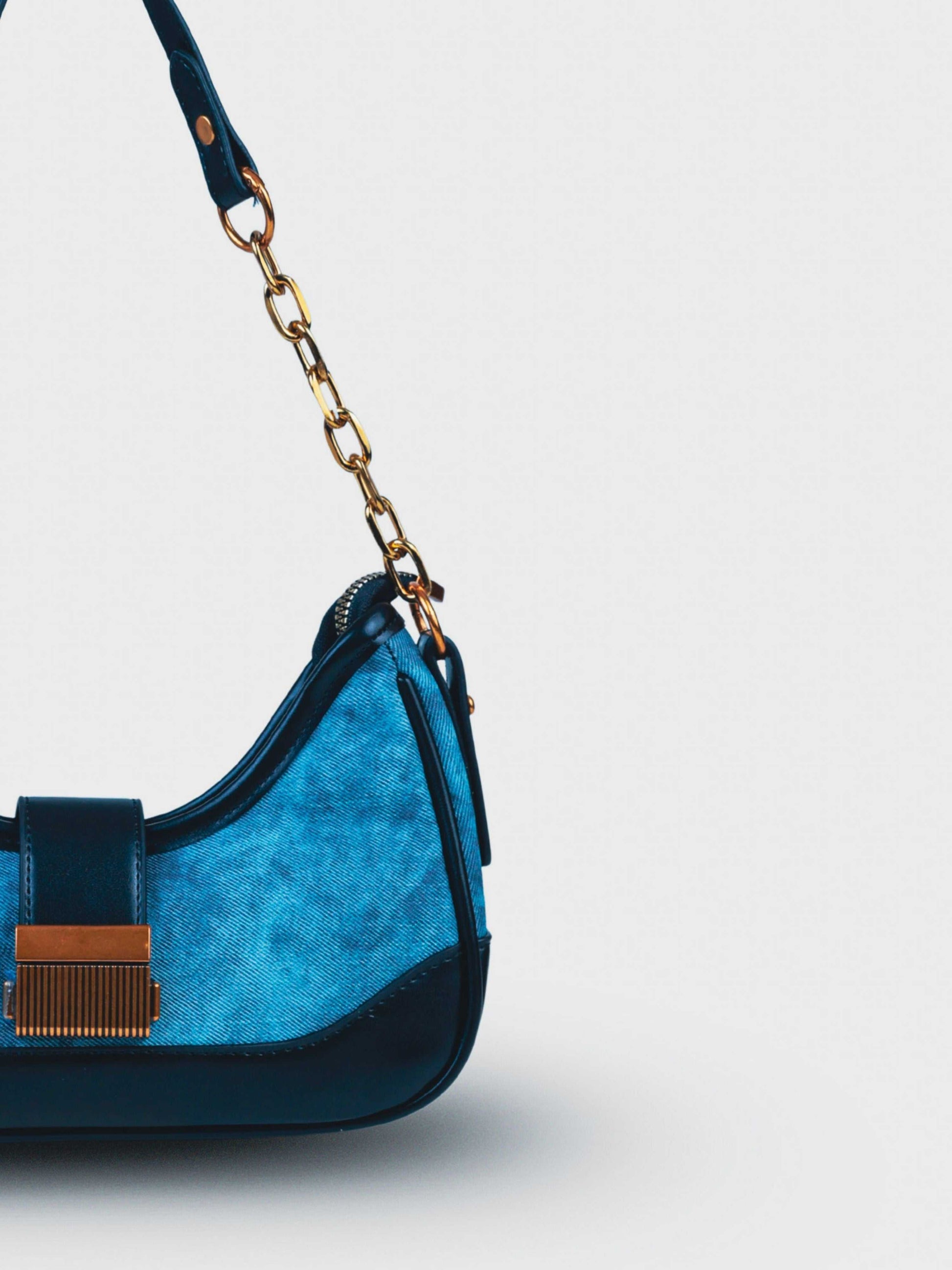 Luna Denim Blue vegan leather shoulder bag in rich blue denim with structured design and chain handle for women.