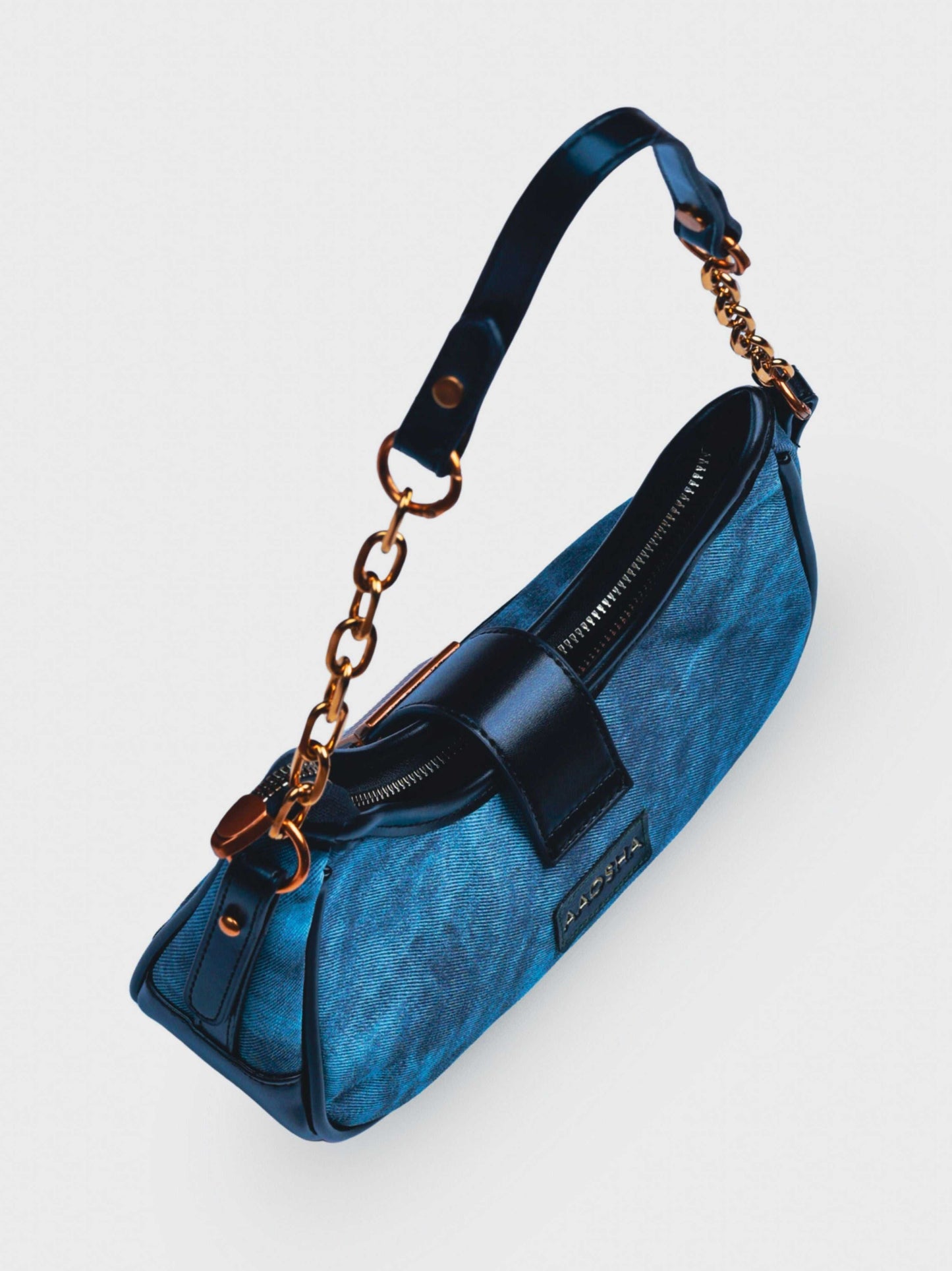 Luna Denim Blue vegan leather shoulder bag in rich blue denim with structured design and chain handle for women.
