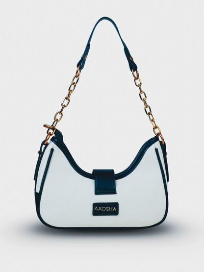 Luna Ivory Noir vegan leather shoulder bag in cream and black tones with structured design and chain handle for women.