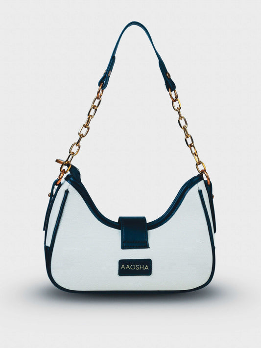 Luna Ivory Noir vegan leather shoulder bag in cream and black tones with structured design and chain handle for women.