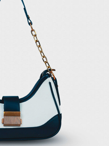 Luna Ivory Noir vegan leather shoulder bag in cream and black tones with structured design and chain handle for women.