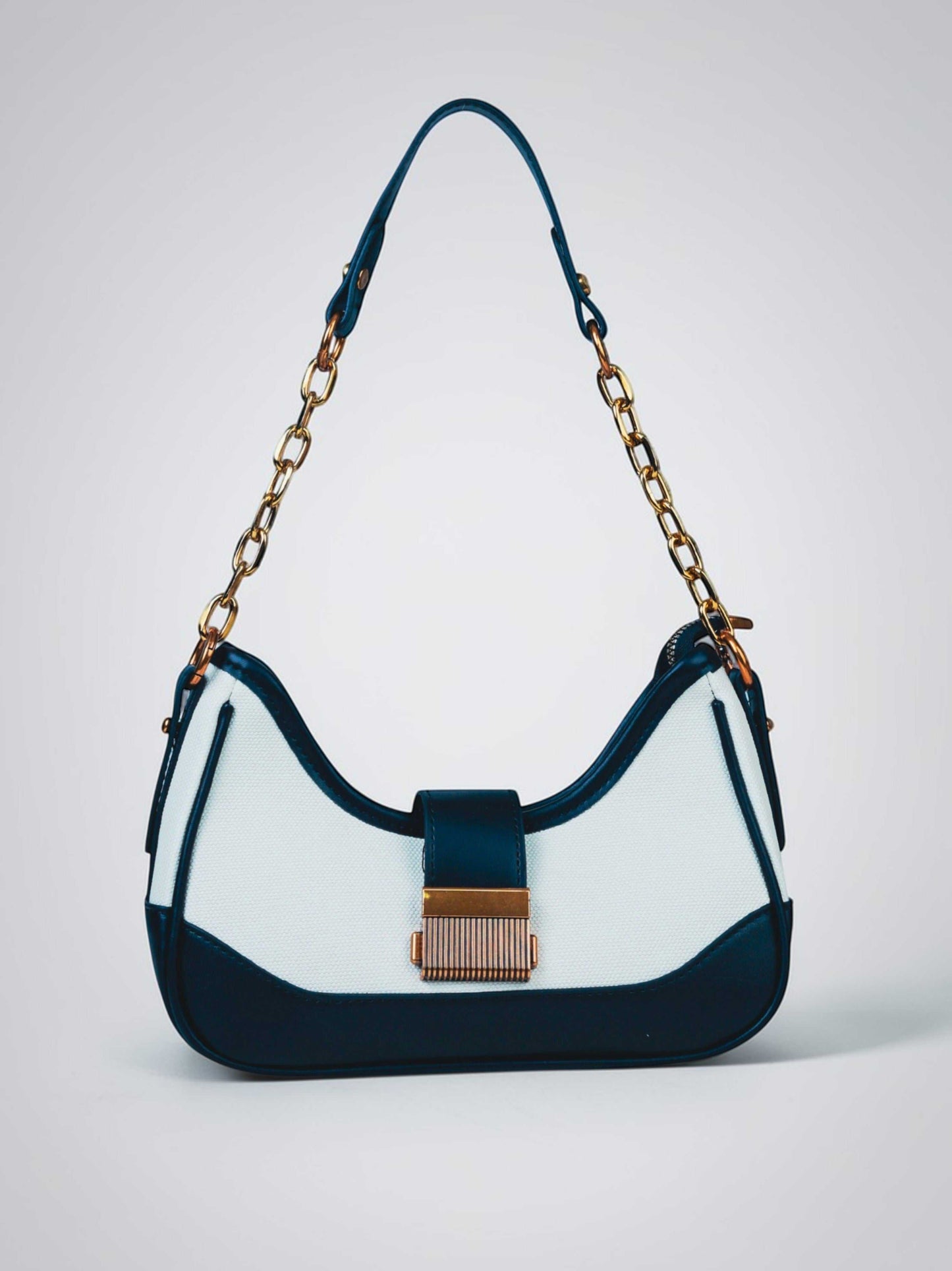 Luna Ivory Noir vegan leather shoulder bag in cream and black tones with structured design and chain handle for women.
