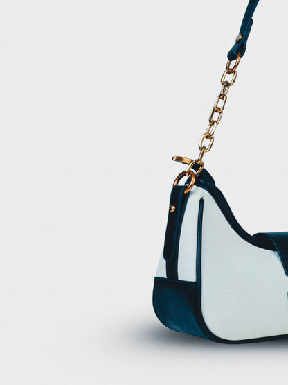Luna Ivory Noir vegan leather shoulder bag in cream and black tones with structured design and chain handle for women.