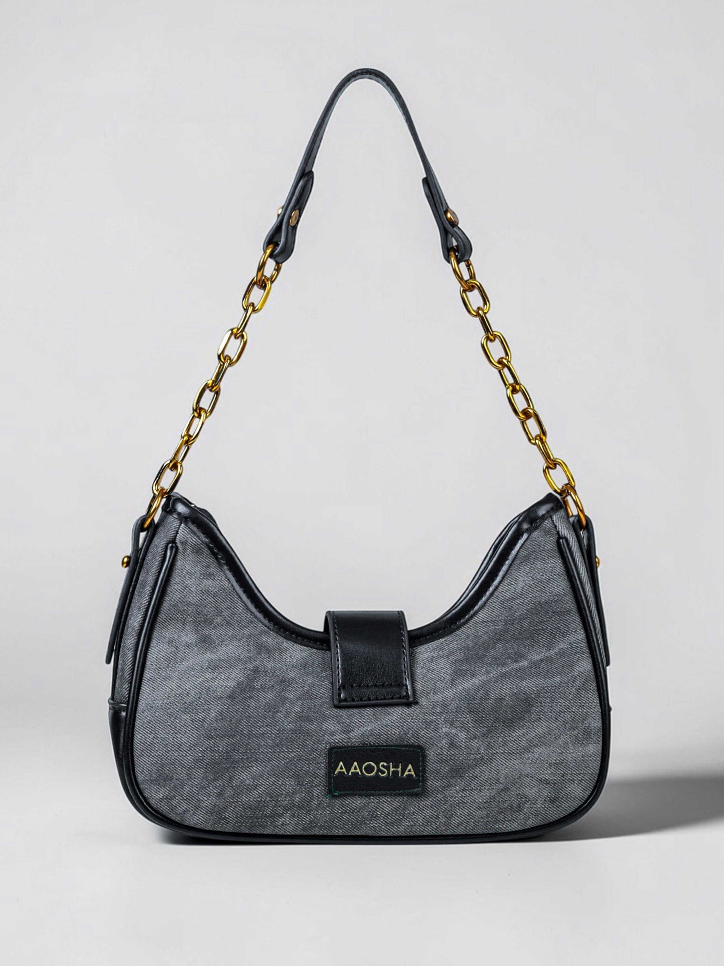 Luna Midnight vegan leather shoulder bag in black denim with structured silhouette and chain handles for women.