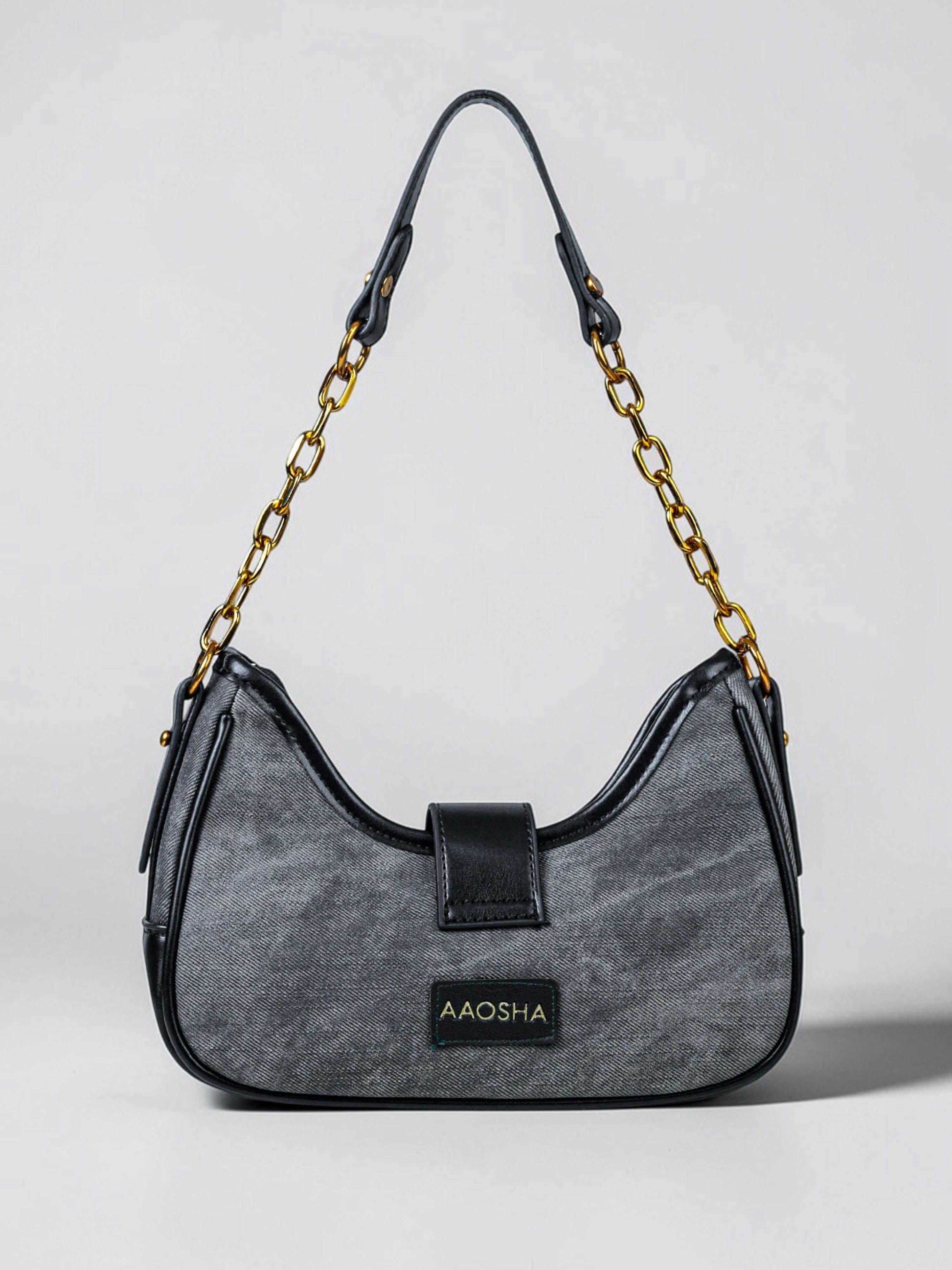 Luna Midnight vegan leather shoulder bag in black denim with structured silhouette and chain handles for women.