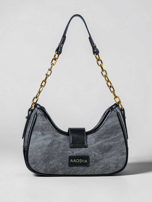 Luna Midnight vegan leather shoulder bag in black denim with structured silhouette and chain handles for women.