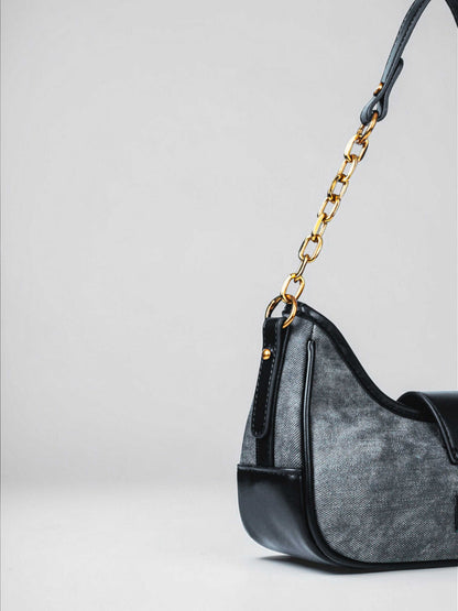 Luna Midnight vegan leather shoulder bag in black denim with structured silhouette and chain handles for women.