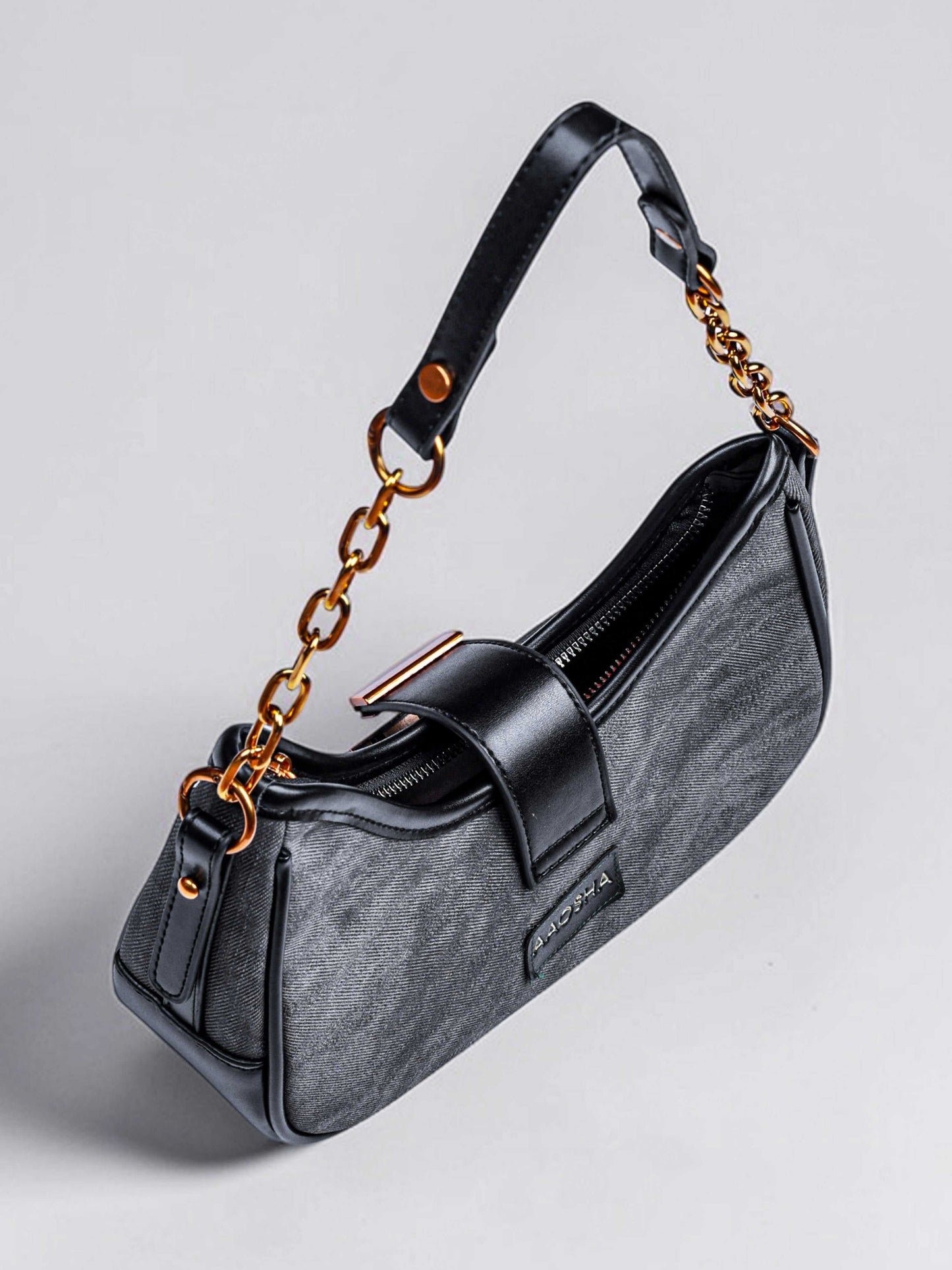 Luna Midnight vegan leather shoulder bag in black denim with structured silhouette and chain handles for women.