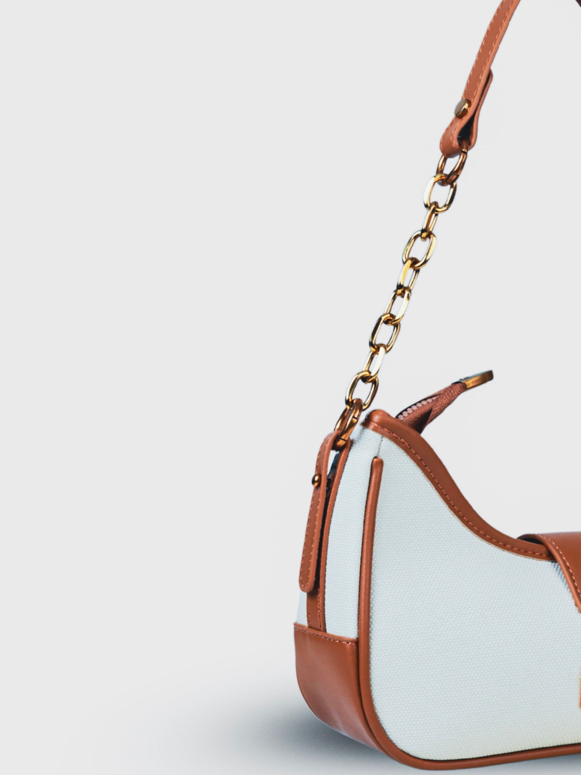 Luna Vanilla Haze vegan leather shoulder bag in soft cream tones with structured design and chain handle for women.