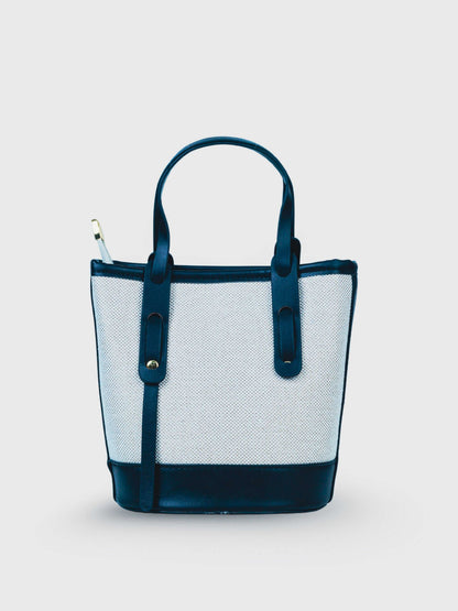Marais Ivory Noir vegan leather crossbody bag featuring cream and black tones with structured bucket shape and adjustable strap for women.