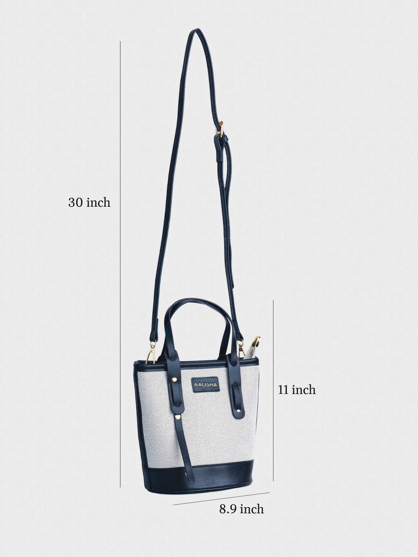 Marais Ivory Noir vegan leather crossbody bag featuring cream and black tones with structured bucket shape and adjustable strap for women.