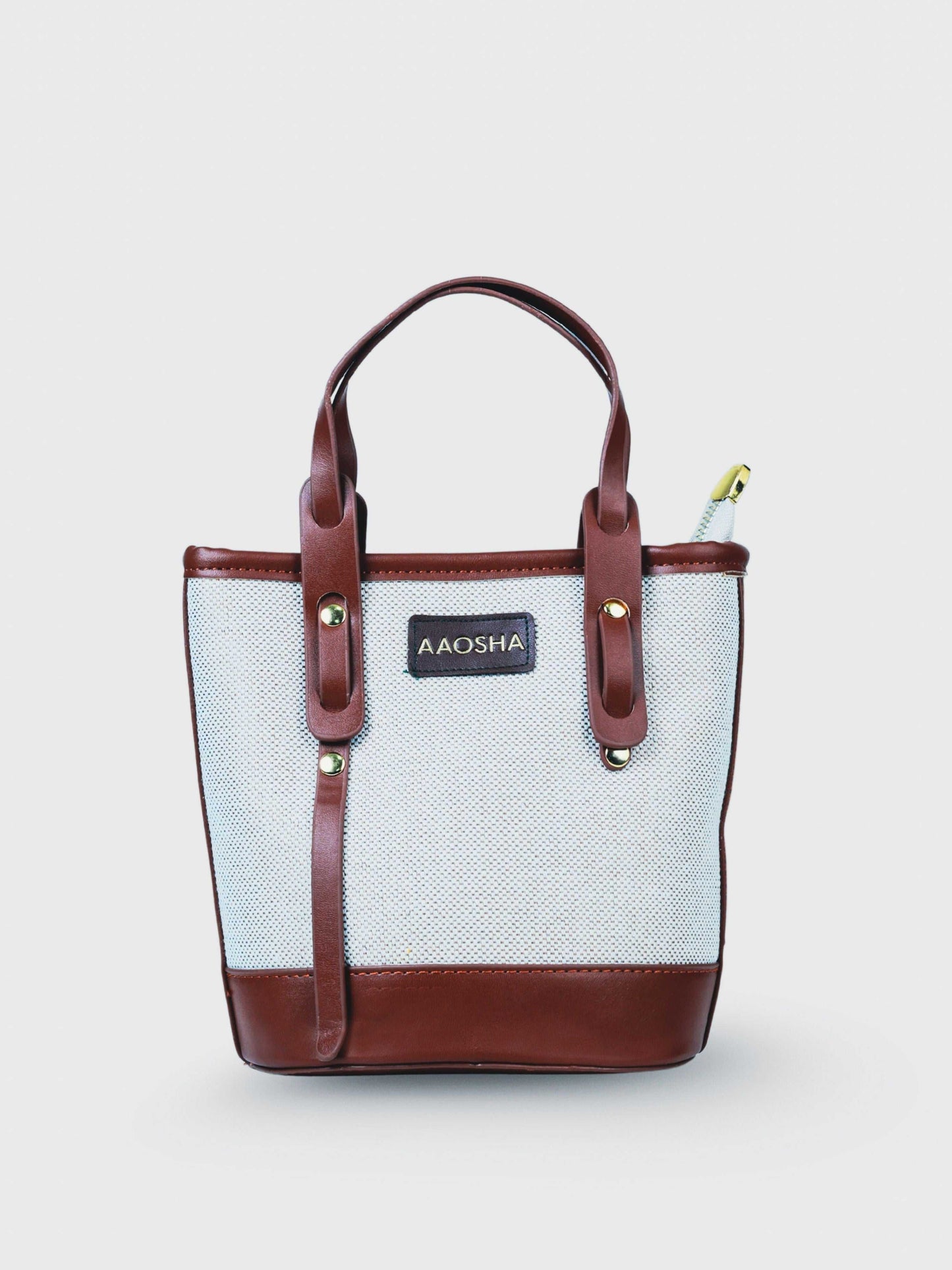 Marais Vanilla Haze vegan leather crossbody bag in warm cream tones with structured bucket shape and adjustable strap for women.