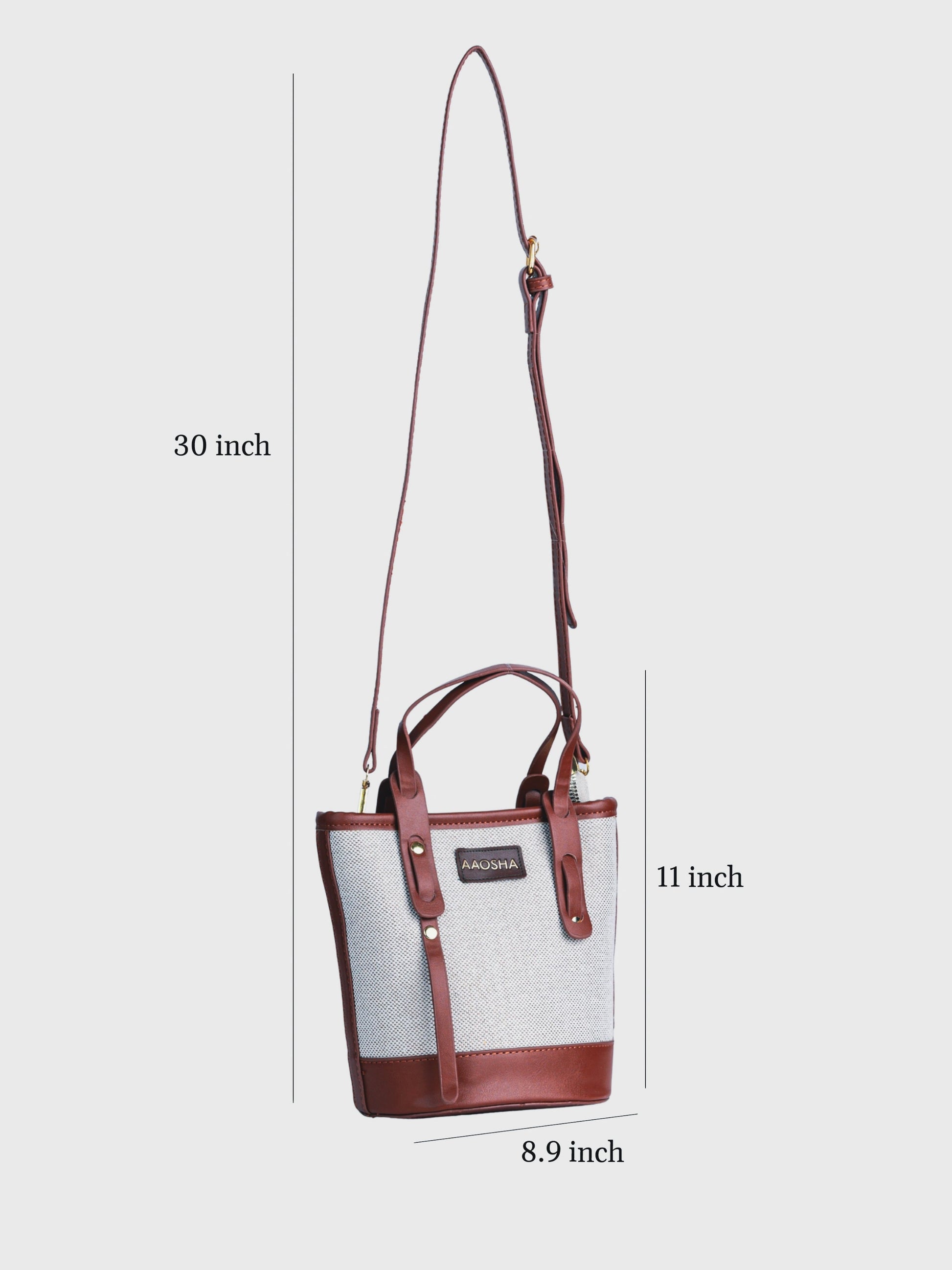 Marais Vanilla Haze vegan leather crossbody bag in warm cream tones with structured bucket shape and adjustable strap for women.