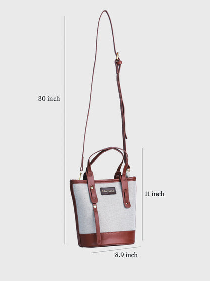 Marais Vanilla Haze vegan leather crossbody bag in warm cream tones with structured bucket shape and adjustable strap for women.