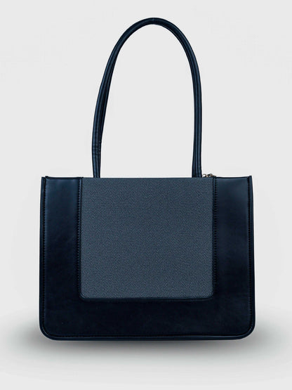 Valencia Eternal Ink vegan leather shoulder bag in pure black with structured silhouette and dual handles for women.