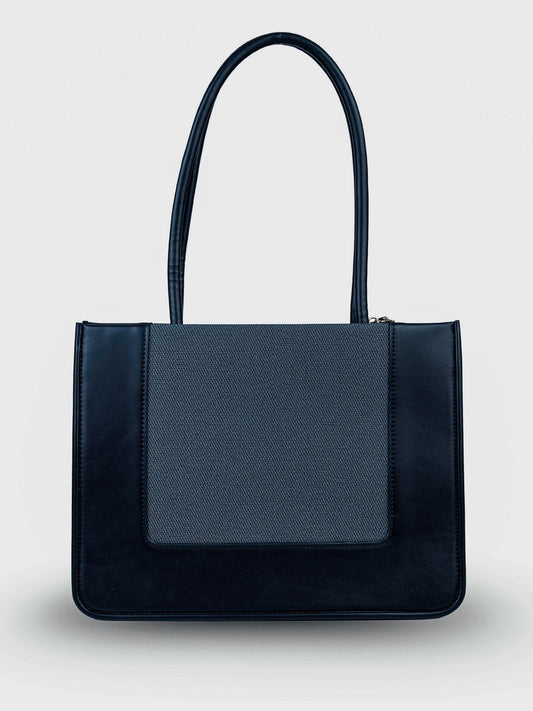 Valencia Eternal Ink vegan leather shoulder bag in pure black with structured silhouette and dual handles for women.