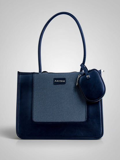 Valencia Eternal Ink vegan leather shoulder bag in pure black with structured silhouette and dual handles for women.