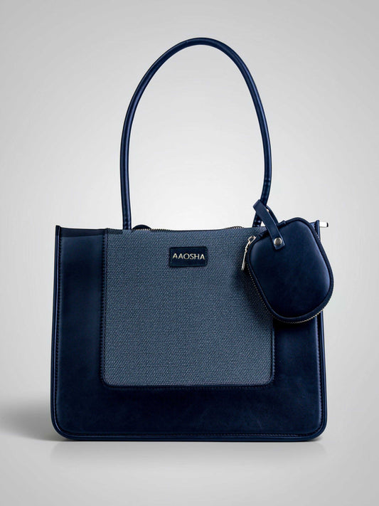 Valencia Eternal Ink vegan leather shoulder bag in pure black with structured silhouette and dual handles for women.