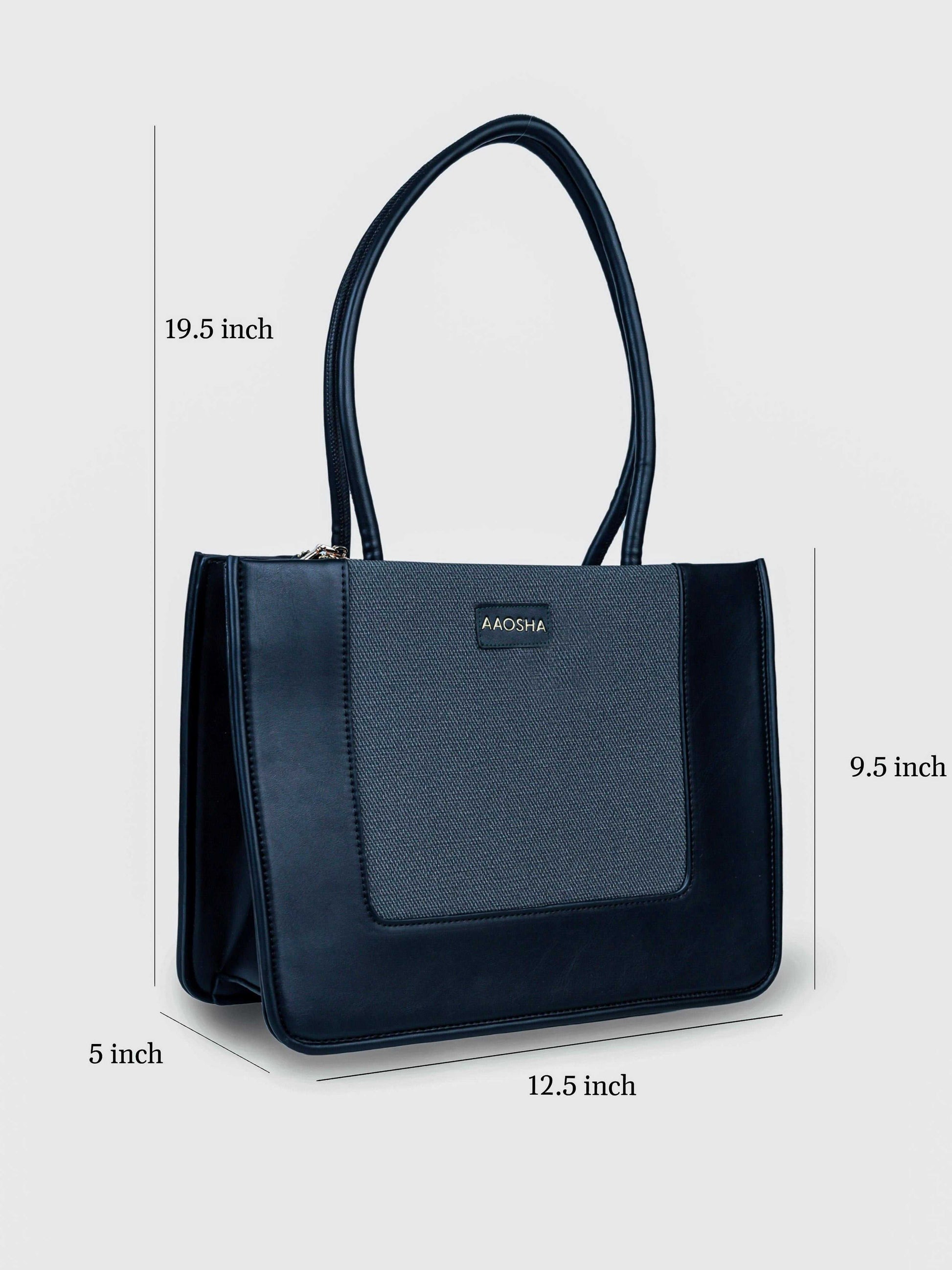 Valencia Eternal Ink vegan leather shoulder bag in pure black with structured silhouette and dual handles for women.