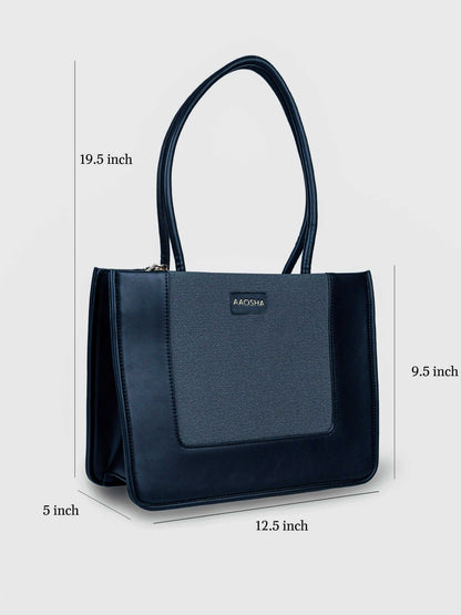 Valencia Eternal Ink vegan leather shoulder bag in pure black with structured silhouette and dual handles for women.