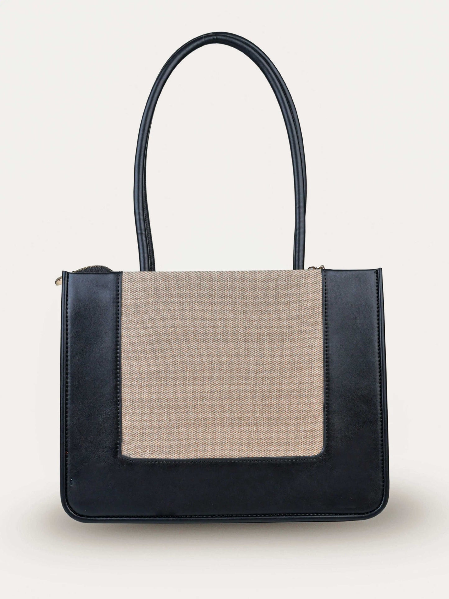 Valencia Ivory Noir vegan leather shoulder bag in cream and black tones with structured design and dual handles for women.