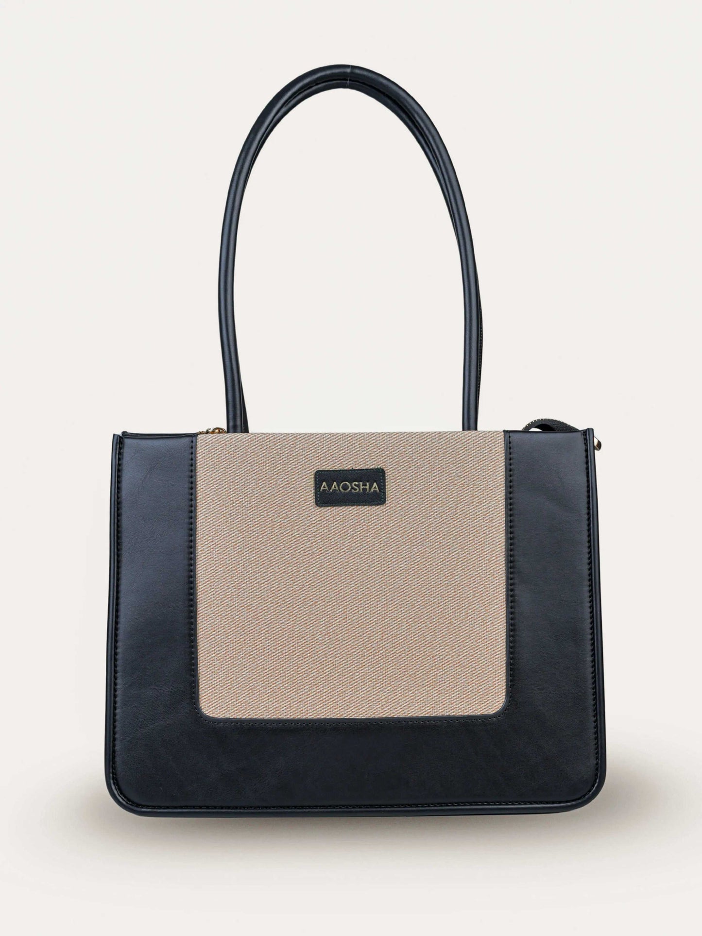 Valencia Ivory Noir vegan leather shoulder bag in cream and black tones with structured design and dual handles for women.