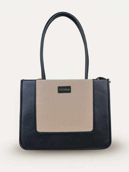 Valencia Ivory Noir vegan leather shoulder bag in cream and black tones with structured design and dual handles for women.