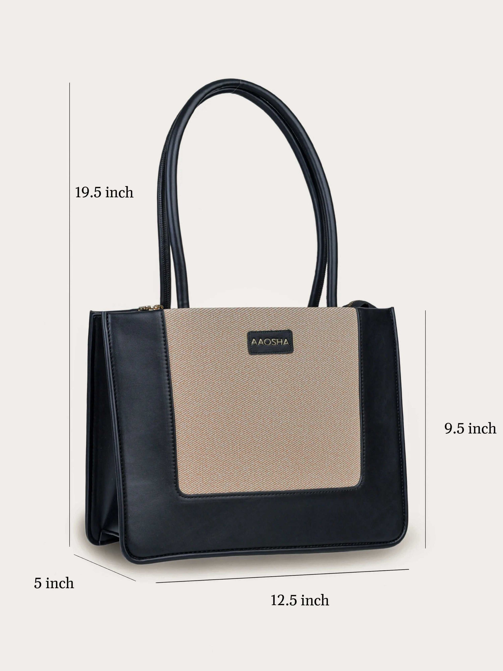 Valencia Ivory Noir vegan leather shoulder bag in cream and black tones with structured design and dual handles for women.