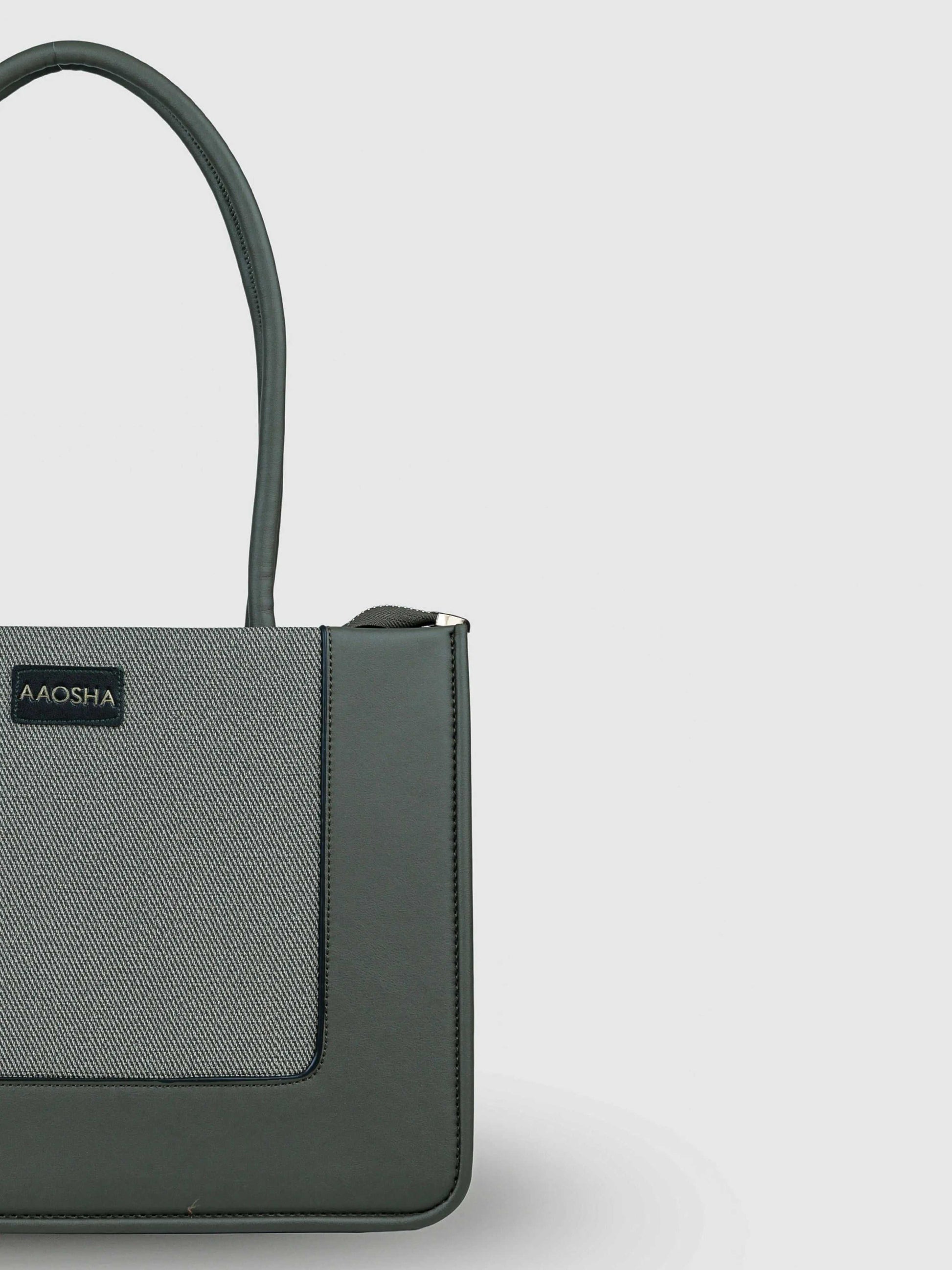 Valencia Sage Mist vegan leather shoulder bag in soft sage green with structured design and dual handles for women.