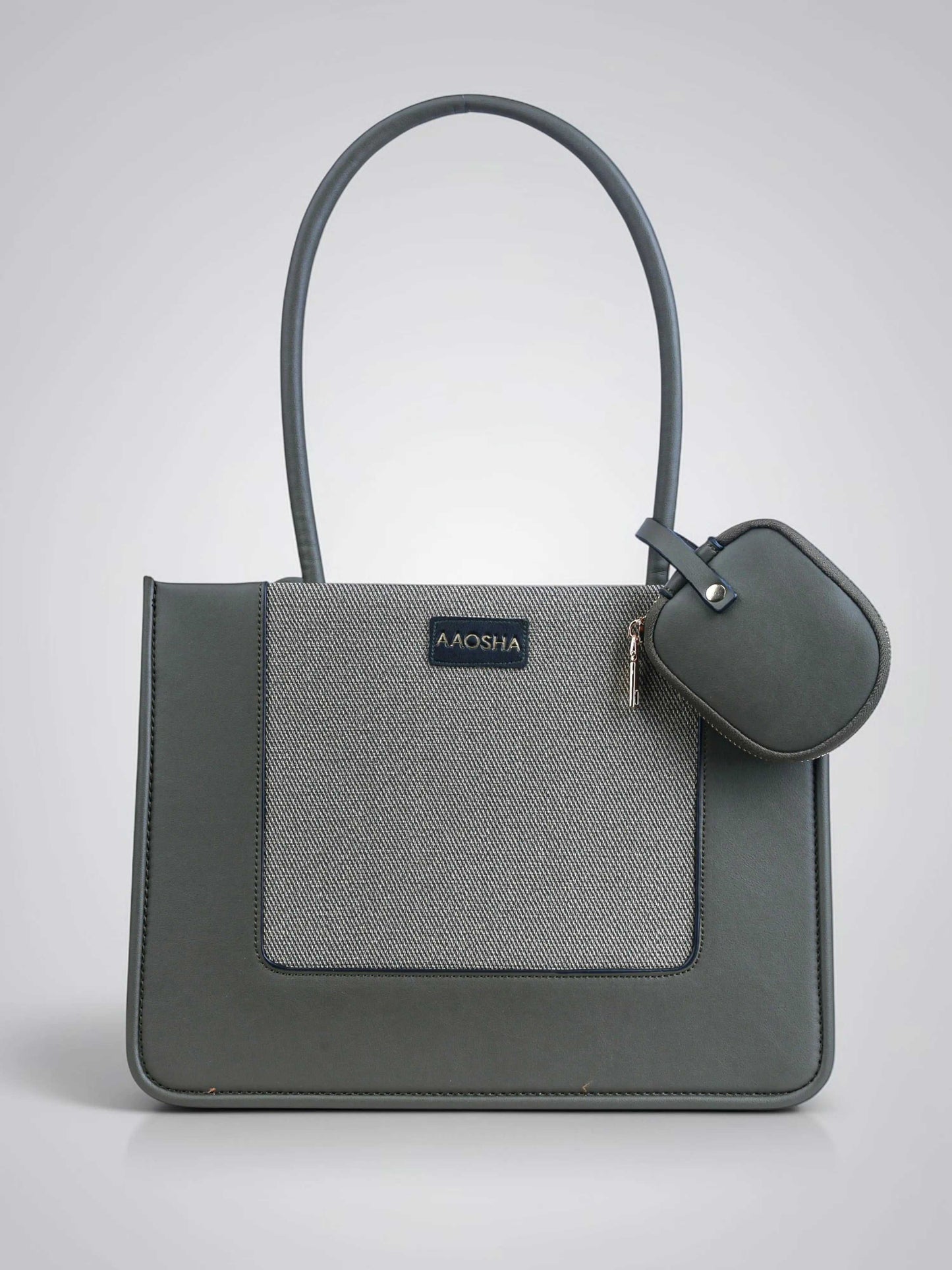 Valencia Sage Mist vegan leather shoulder bag in soft sage green with structured design and dual handles for women.
